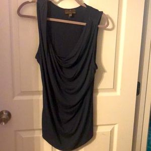 Sleeveless top with draped front.